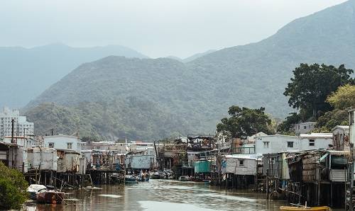 river with huts along bank