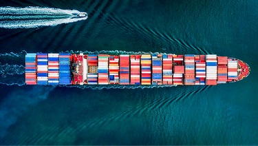 Photograph of a container ship from above.