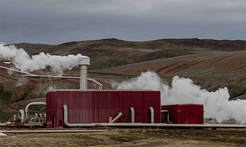 A geothermal power generator blowing steam
