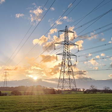 Electricity pylons across a field